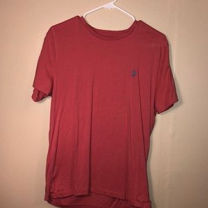 salmon colored polo shirt